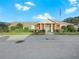 Brick community center with landscaping and flagpole at 341 Lake Suzanne Dr, Lake Wales, FL 33859