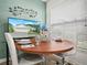 Cozy dining area with a round table and two white chairs at 341 Lake Suzanne Dr, Lake Wales, FL 33859