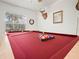 Pool table with billiard balls in a game room at 341 Lake Suzanne Dr, Lake Wales, FL 33859