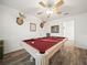 Game room with pool table, wood floors, and deer head mounts at 341 Lake Suzanne Dr, Lake Wales, FL 33859