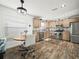 Spacious kitchen with an island and stainless steel appliances at 341 Lake Suzanne Dr, Lake Wales, FL 33859