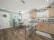 Bright kitchen with stainless steel appliances and light wood cabinets at 341 Lake Suzanne Dr, Lake Wales, FL 33859