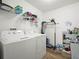 Laundry room with washer, dryer, shelving and hanging rack at 341 Lake Suzanne Dr, Lake Wales, FL 33859