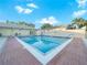 Community pool with brick deck, offering a refreshing escape at 341 Lake Suzanne Dr, Lake Wales, FL 33859