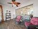 Bright and airy screened patio with wicker seating and ceiling fan at 341 Lake Suzanne Dr, Lake Wales, FL 33859