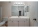 Bright bathroom with white vanity and large mirror at 5011 Hemingway Cir # 5011, Haines City, FL 33844