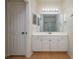 Bathroom with white vanity, large mirror, and shower/tub combo at 5011 Hemingway Cir # 5011, Haines City, FL 33844