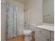 Bathroom with shower/tub combo, white vanity, and wood-look tile floors at 5011 Hemingway Cir # 5011, Haines City, FL 33844
