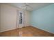 Light and airy bedroom with wood-look tile floors and large window at 5011 Hemingway Cir # 5011, Haines City, FL 33844