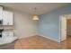 Dining area with wood-look tile and access to the laundry room at 5011 Hemingway Cir # 5011, Haines City, FL 33844