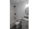 Clean, modern bathroom with marble countertop, white vanity, and black fixtures at 815 S Seminole Ave, Fort Meade, FL 33841