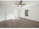 Bright bedroom with hardwood floors and a large window at 815 S Seminole Ave, Fort Meade, FL 33841