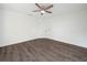 Empty bedroom with wood-look flooring and ceiling fan at 815 S Seminole Ave, Fort Meade, FL 33841