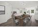 Open concept dining area with wood table and chairs, adjacent to the kitchen at 815 S Seminole Ave, Fort Meade, FL 33841