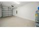 Empty garage with overhead door and concrete floor at 815 S Seminole Ave, Fort Meade, FL 33841