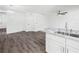 Modern kitchen with white cabinets, granite countertops and stainless steel appliances at 815 S Seminole Ave, Fort Meade, FL 33841
