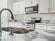 Modern kitchen with stainless steel appliances and granite countertops at 815 S Seminole Ave, Fort Meade, FL 33841