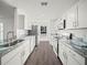 Modern kitchen with stainless steel appliances and granite countertops at 815 S Seminole Ave, Fort Meade, FL 33841