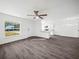 Spacious living room featuring hardwood floors and an open kitchen view at 815 S Seminole Ave, Fort Meade, FL 33841