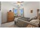 Spacious bedroom with wood dresser and a queen-size bed at 337 Motorcoach S Dr, Polk City, FL 33868