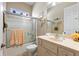 Clean bathroom with tub, shower, and updated vanity at 337 Motorcoach S Dr, Polk City, FL 33868