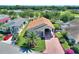 Aerial view of a single-Gathering home with a large driveway and RV garage at 337 Motorcoach S Dr, Polk City, FL 33868