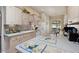 Kitchen with light-colored cabinetry, ample counter space, and a breakfast bar at 337 Motorcoach S Dr, Polk City, FL 33868
