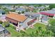 Aerial view showcasing a home's backyard with a large covered patio at 337 Motorcoach S Dr, Polk City, FL 33868