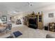 Spacious living room with tile floors, comfortable seating, and a large TV at 337 Motorcoach S Dr, Polk City, FL 33868
