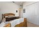 Charming bedroom with wood bed frame, ample closet space, and neutral decor at 337 Motorcoach S Dr, Polk City, FL 33868