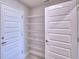 Walk-in pantry with wire shelving and neutral paint at 4926 Vue Delac Pass, Auburndale, FL 33823