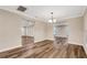 Dining room with chandelier and wood-look floors at 7510 Catherine Dr, Lakeland, FL 33810