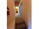 Upstairs hallway with access to bedrooms and bathroom at 8425 Crystal Cove Loop, Kissimmee, FL 34747