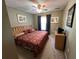 King-size bedroom with patterned bedding and a ceiling fan at 8425 Crystal Cove Loop, Kissimmee, FL 34747