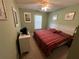 King-size bed, ceiling fan, and ample closet space at 8425 Crystal Cove Loop, Kissimmee, FL 34747