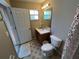 Clean bathroom with toilet, sink, and shower at 8425 Crystal Cove Loop, Kissimmee, FL 34747
