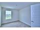 Charming bedroom with a window and carpet flooring at 1413 Leamington Ln, Winter Haven, FL 33884