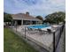 Clean community pool with surrounding patio furniture at 4773 Nw 32Nd St, Ocala, FL 34482