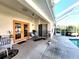 Relaxing patio with pool access, inviting seating, and a view of the lush backyard at 4773 Nw 32Nd St, Ocala, FL 34482