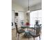 Kitchen with glass-top dining table and four chairs at 4773 Nw 32Nd St, Ocala, FL 34482