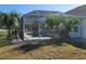 Enjoy this private screened-in pool with lush landscaping at 4773 Nw 32Nd St, Ocala, FL 34482