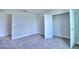 Bright bedroom with neutral walls, carpet, and a spacious closet at 1492 Leamington Ln, Winter Haven, FL 33884