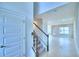 Bright and airy foyer with a staircase leading to the second floor at 1492 Leamington Ln, Winter Haven, FL 33884