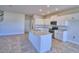 Modern kitchen featuring white cabinets and granite countertops at 1417 Leamington Ln, Winter Haven, FL 33884