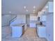 Modern kitchen with island and stainless steel appliances at 1417 Leamington Ln, Winter Haven, FL 33884