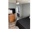 Spacious bedroom with wood-look flooring and ceiling fan at 50989 Highway 27 # 230, Davenport, FL 33897