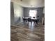 Dining room with a table and four chairs, hardwood floors at 50989 Highway 27 # 230, Davenport, FL 33897