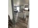 Open concept kitchen with island and a view into the dining area at 50989 Highway 27 # 230, Davenport, FL 33897
