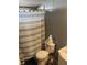 Clean bathroom with a toilet, sink, and striped shower curtain at 50989 Highway 27 # 230, Davenport, FL 33897
