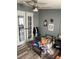 A bedroom with a twin bed, toys, and french doors at 50989 Highway 27 # 230, Davenport, FL 33897